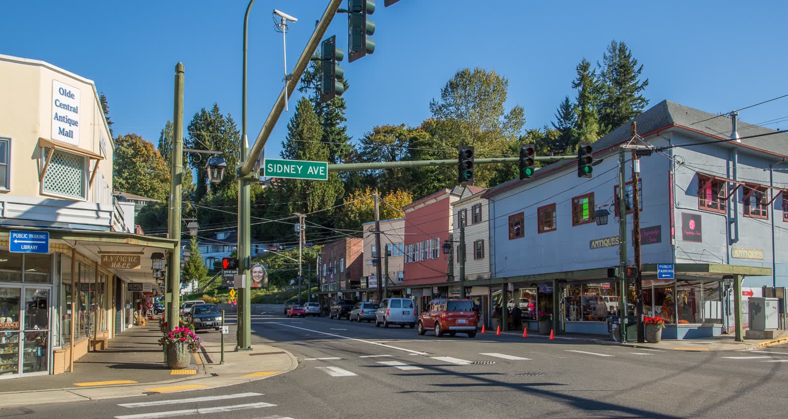 Colorful storefronts and covered sidewalks along Bay Street in downtown Port Orchard.